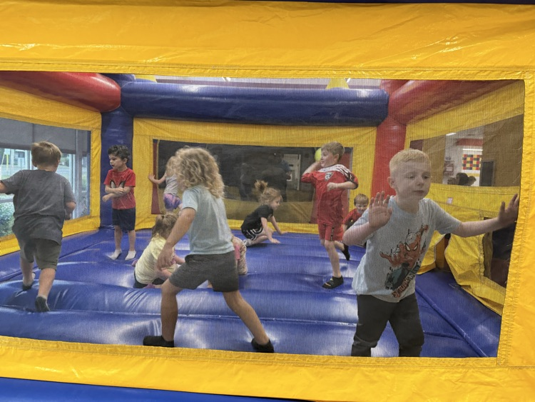 Students participating in the inflatable reward! 