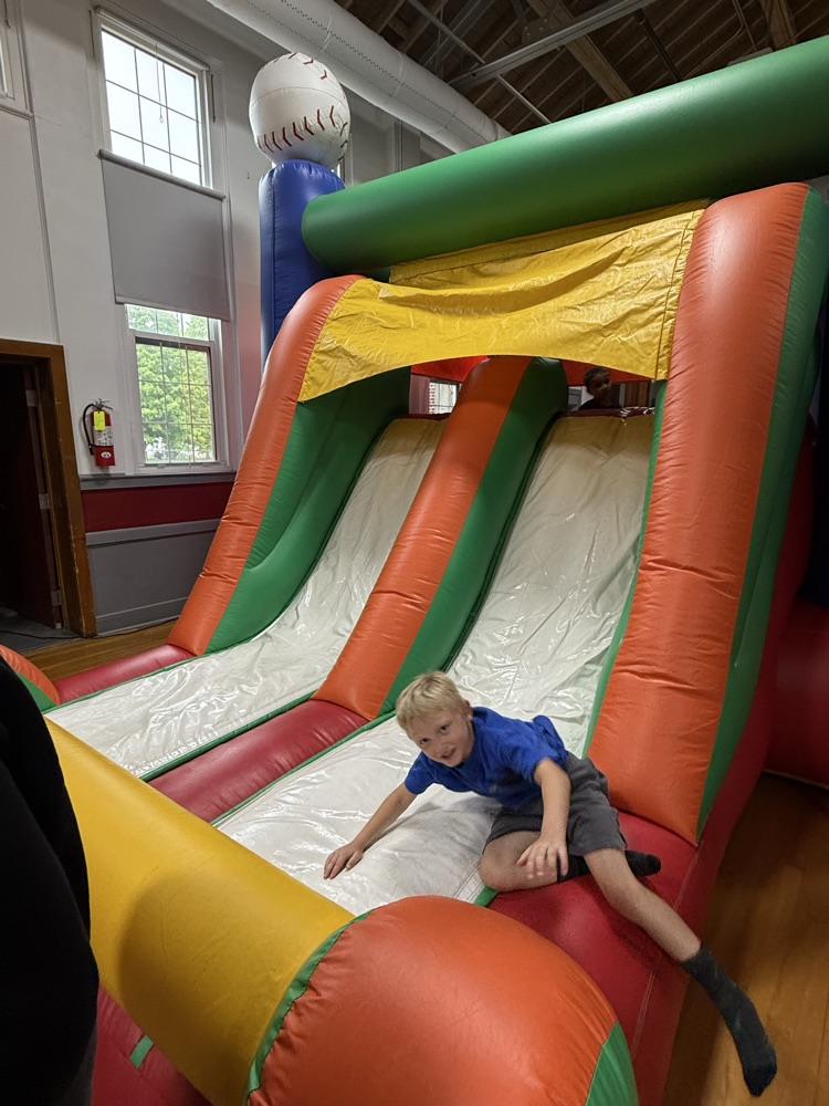 Students participating in the inflatable reward! 