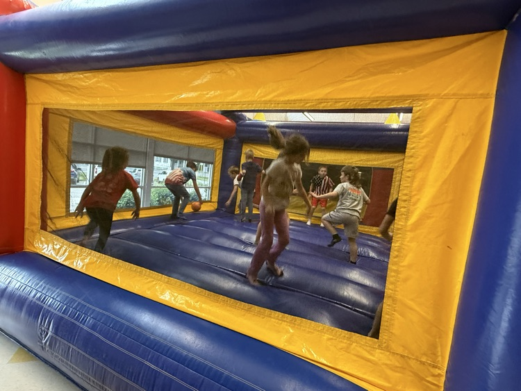 Students participating in the inflatable reward! 