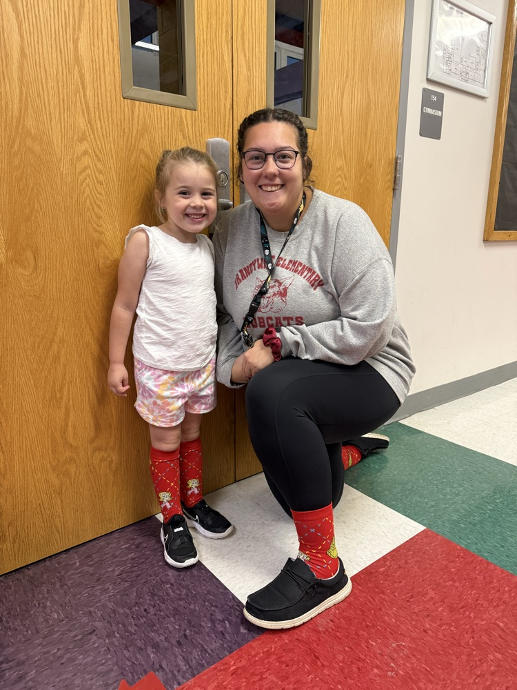 Miss Wright and her matching wacky socks with a kindergartener!
