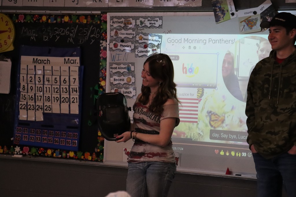CACC student showing off a welding helmet