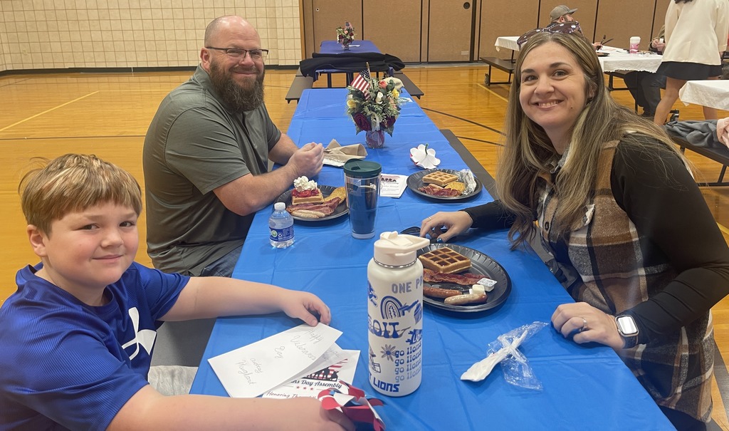 Amy and Phil Grondsma, veterans, and son, BoBo, having breakfast for veteran's day