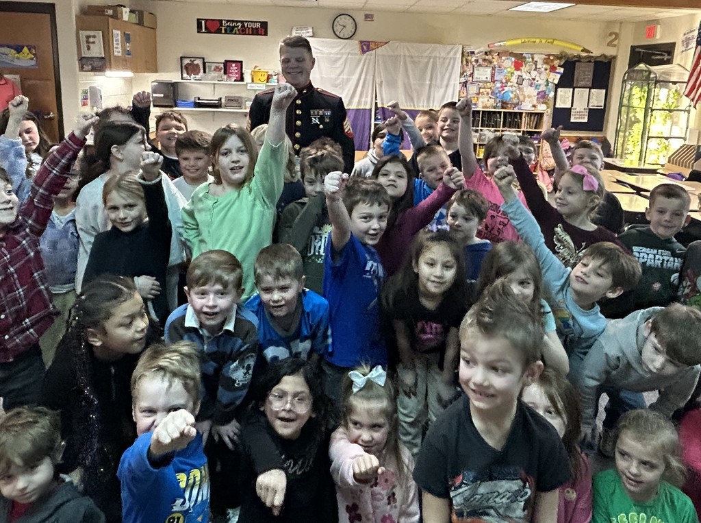Pentwater Elementary students enjoy listening to a real-life superhero read, Marine Sergeant Simpson.