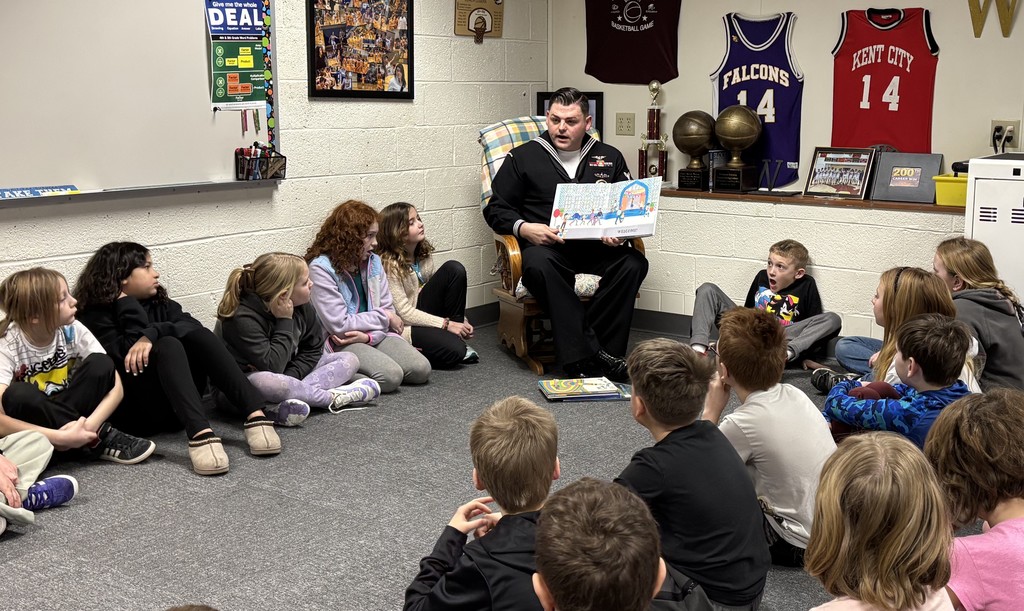 Pentwater Elementary students enjoy listening to a real-life superhero read, Navy Petty Officer Brown.