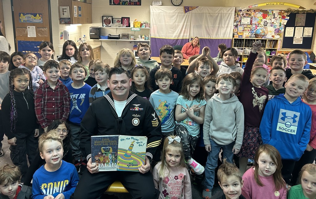 Pentwater Elementary students enjoy listening to a real-life superhero read, Navy Petty Officer Brown.