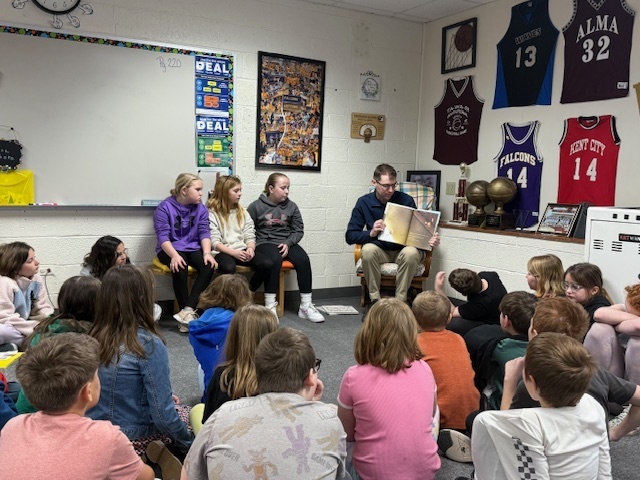 Pentwater Elementary students enjoy listening to a United States Air Force Senior Airman for March is Reading Month.
