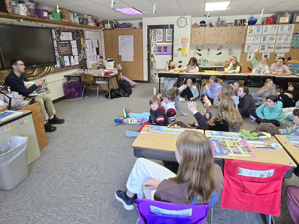 Pentwater Elementary students enjoy listening to a United States Air Force Senior Airman for March is Reading Month.