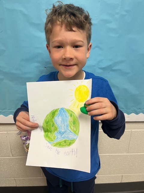 2nd grade winner holding art - Arlo Radvansky