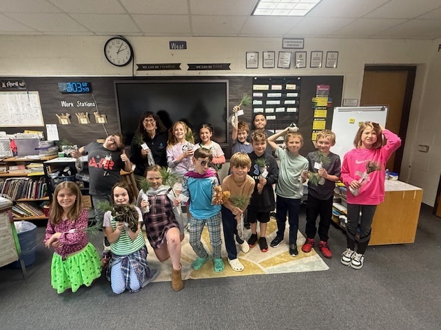 3rd graders with their white pine seedlings.