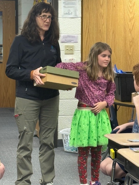 Alona with Mrs. Wilson from the Oceana Conservation District trying to guess what is in the box.
