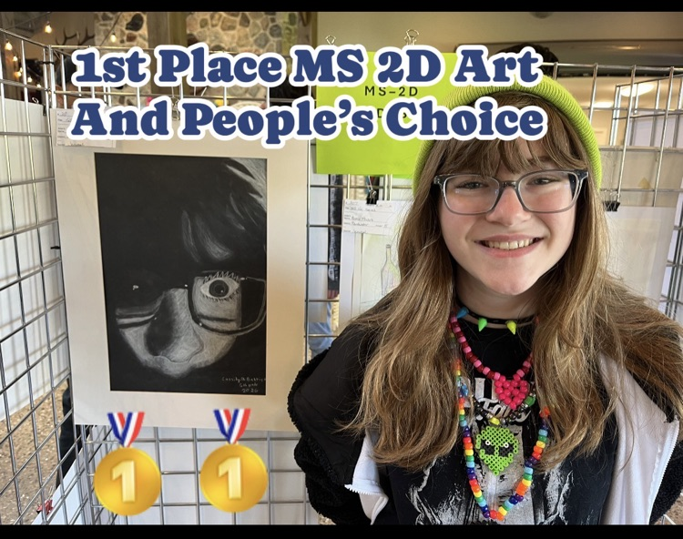 Cassidy is standing in front of her self portrait. 