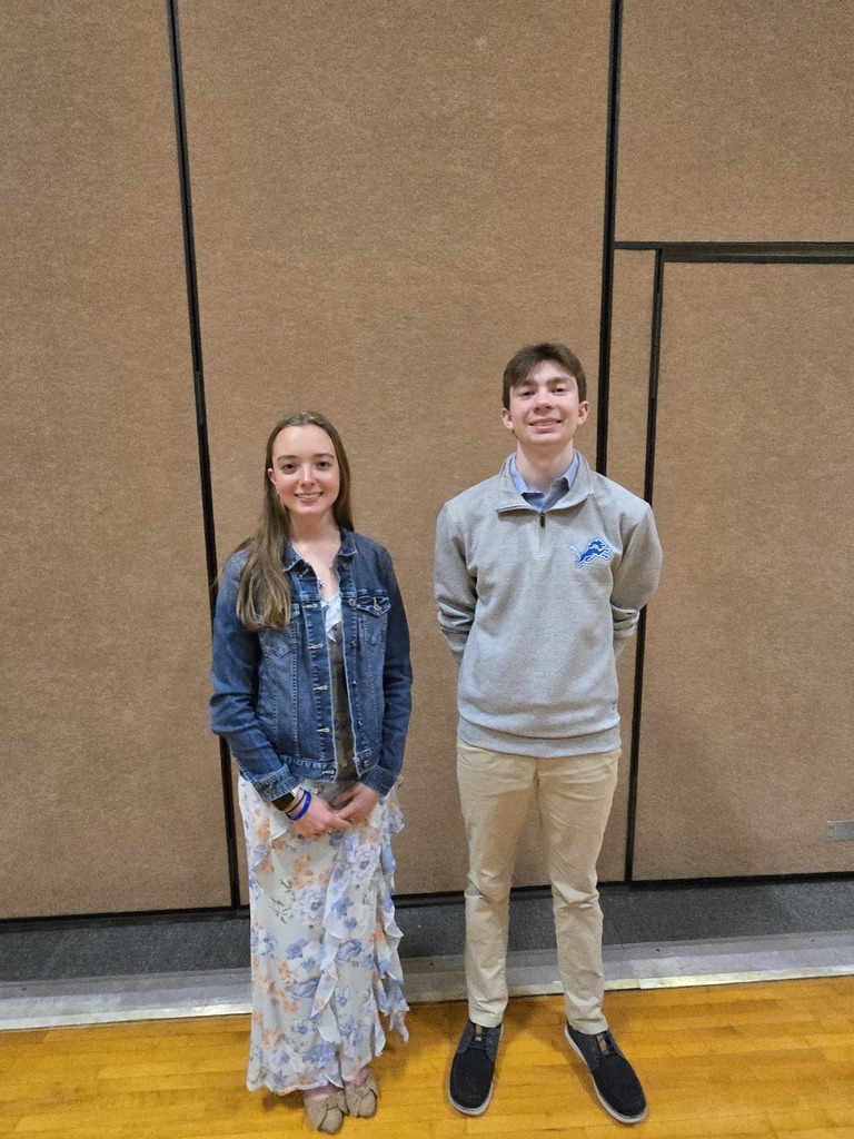 Maggie and Ben in dress clothes posing