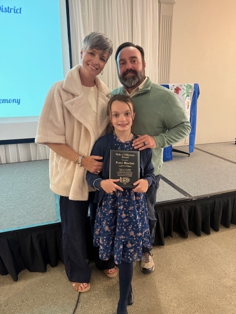 Porter and her parents at the awards ceremony for Make A Difference
