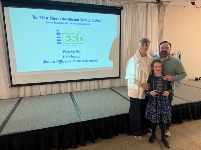Porter and her parents at the Make A Difference Award Ceremony