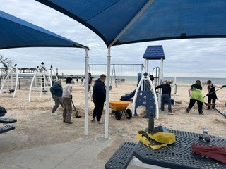 Students shoveling sand at the state park
