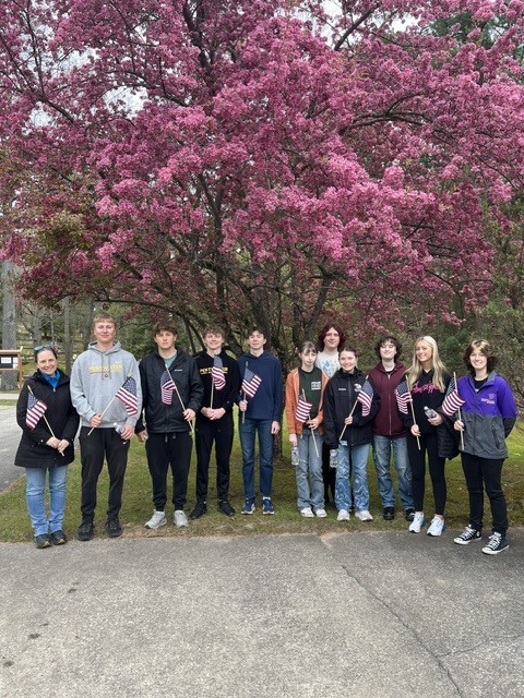 NHS at the cemetery putting out flags!