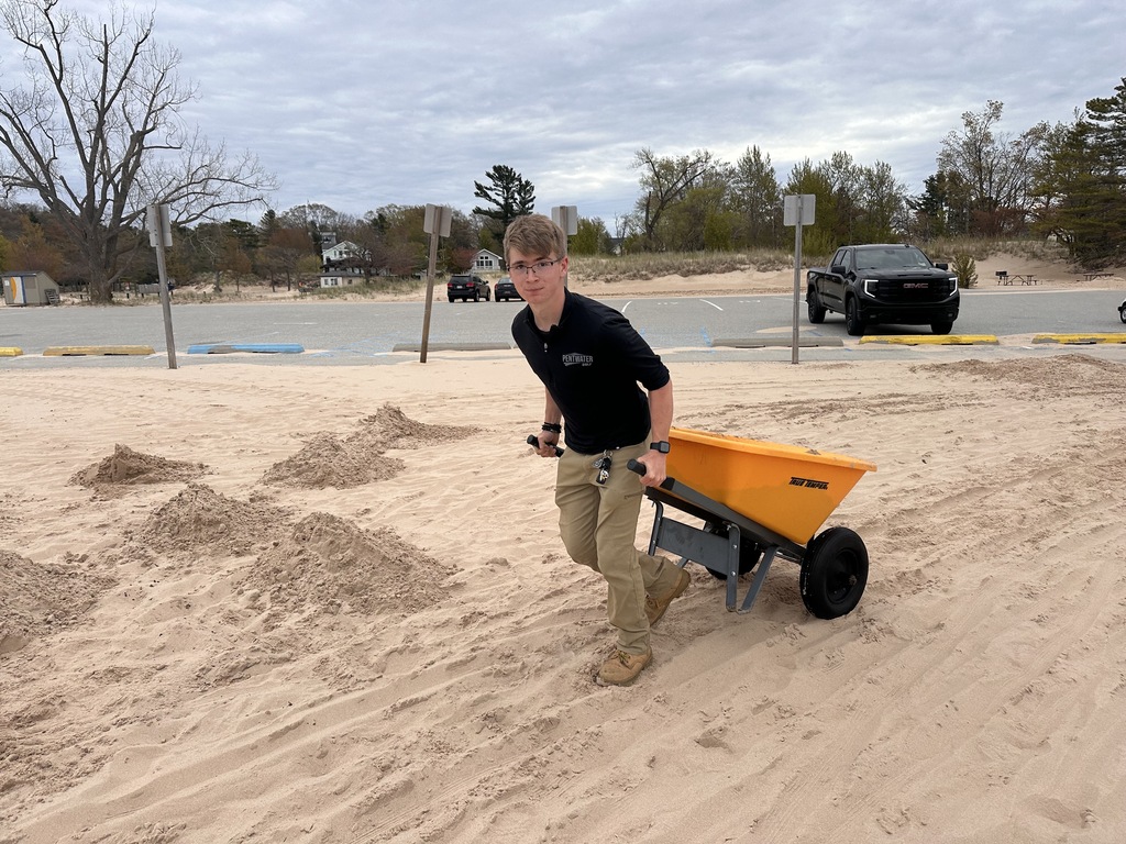 Aiden Henry shoving sand at the state park