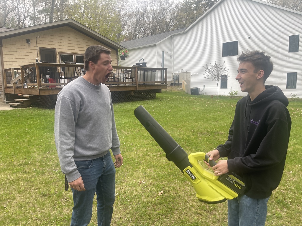 Mr. Holstad with Wyatt Roberts and the leaf blower