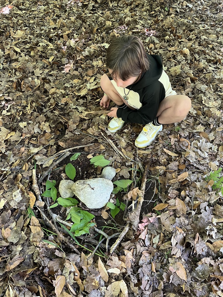 A Student is designing a nest at MI Legacy Art Park