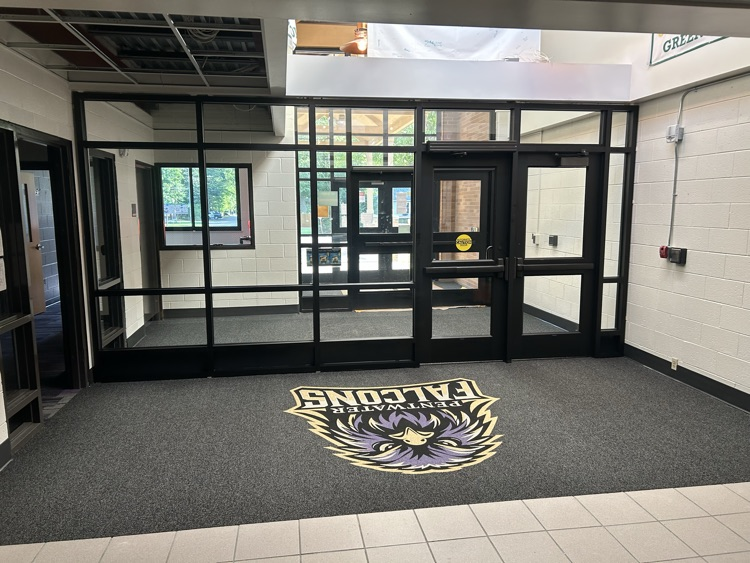 new logo in carpet in front lobby