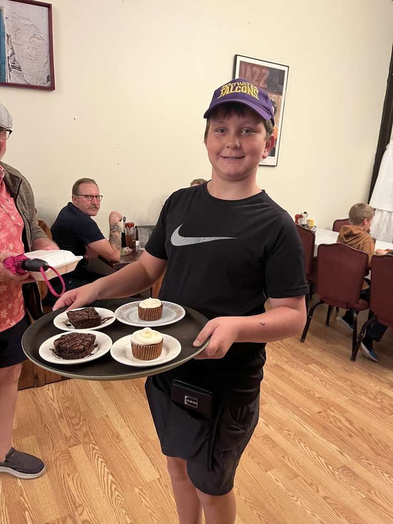 Anderson serves a tray of desserts.