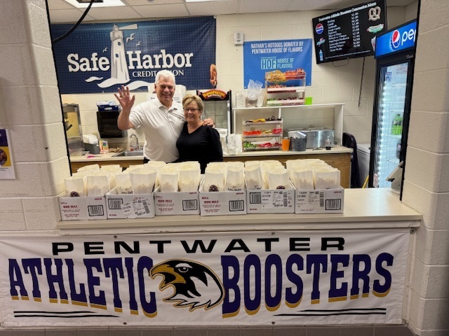 Coach Brown and Mrs. Brown popping popcorn for our students.