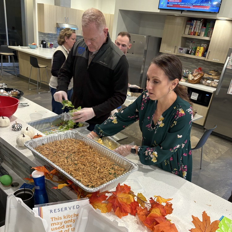 Members of ROE team serving lunch