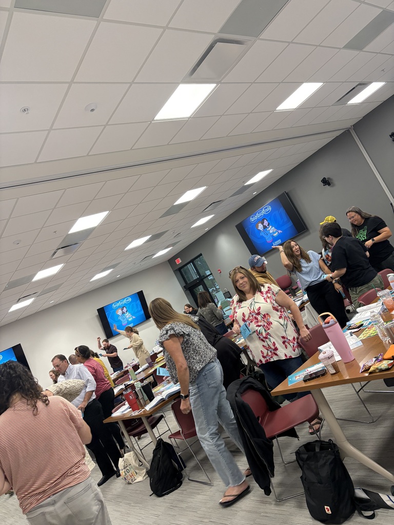 Educators participating in an engagement strategy during Kagan Cooperative Learning Workshop