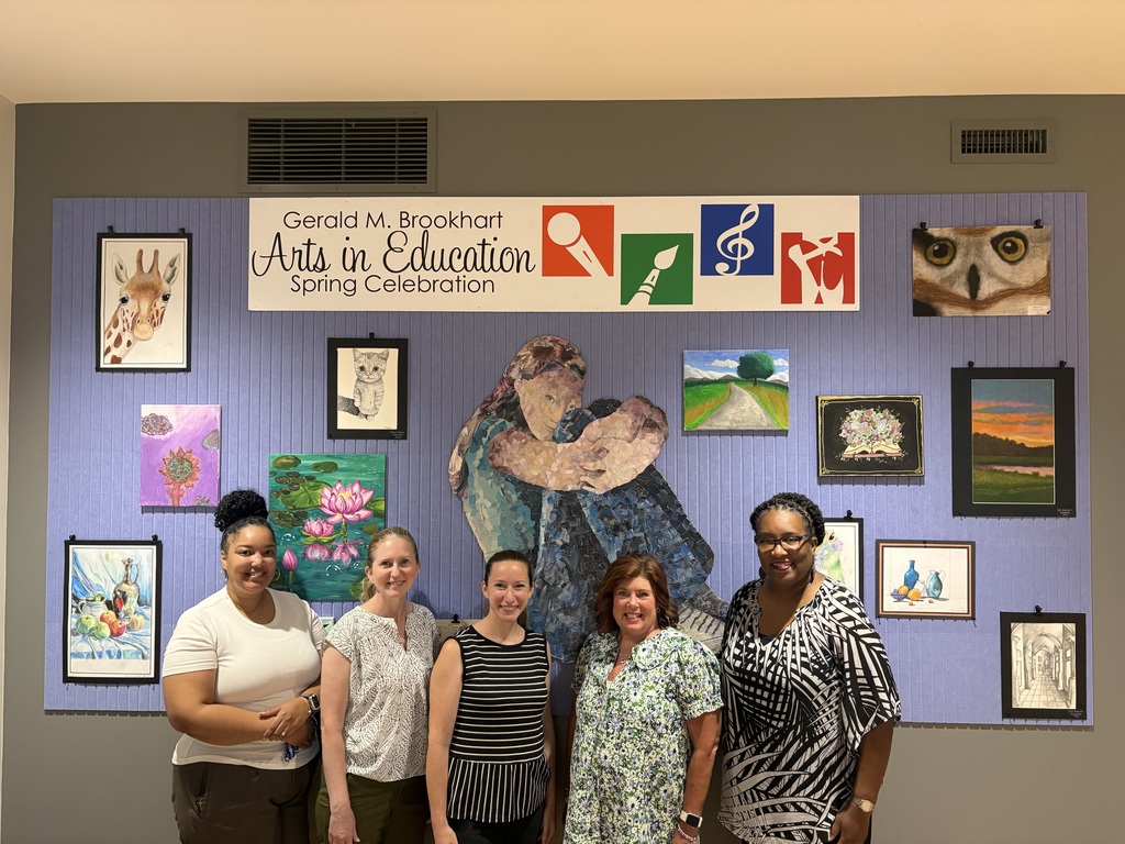 Peoria ROE 48 PL team members in front of our new GMB art display!
