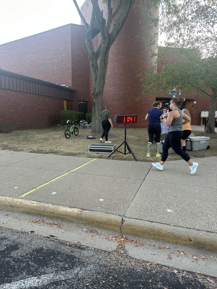 Mrs. Fryman crossing the finish line