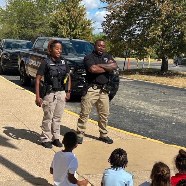 Officer Birris and Officer Fuller with K Students
