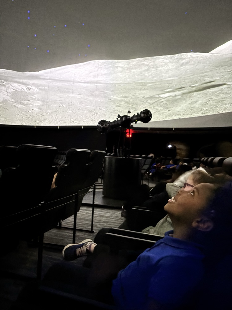 watching the planetarium show 
