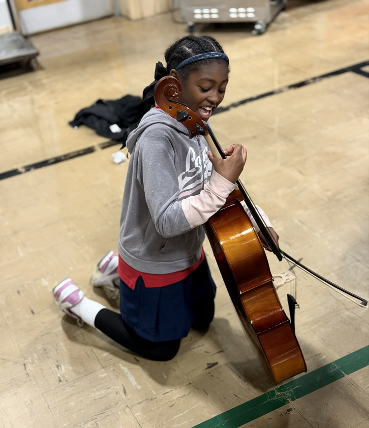 Kalayah got to try out the cello in our strings area!