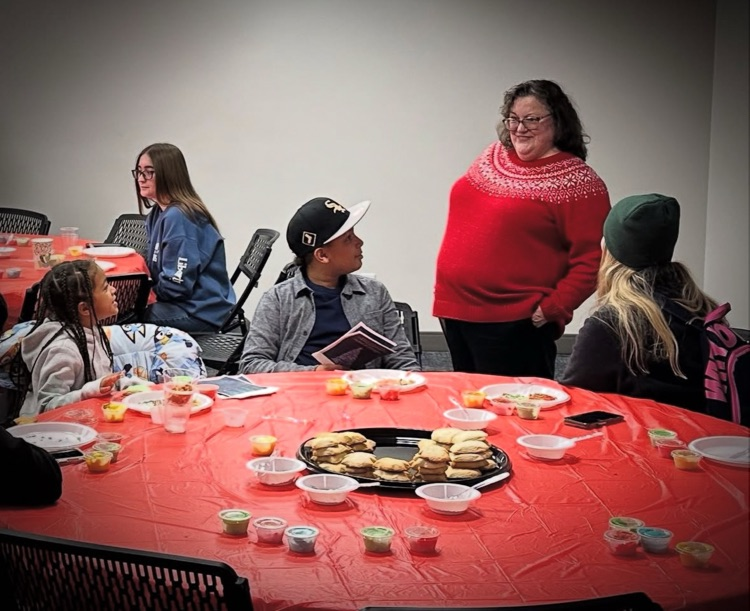 Mrs. Davis visiting with Ryland and his family after the concert.