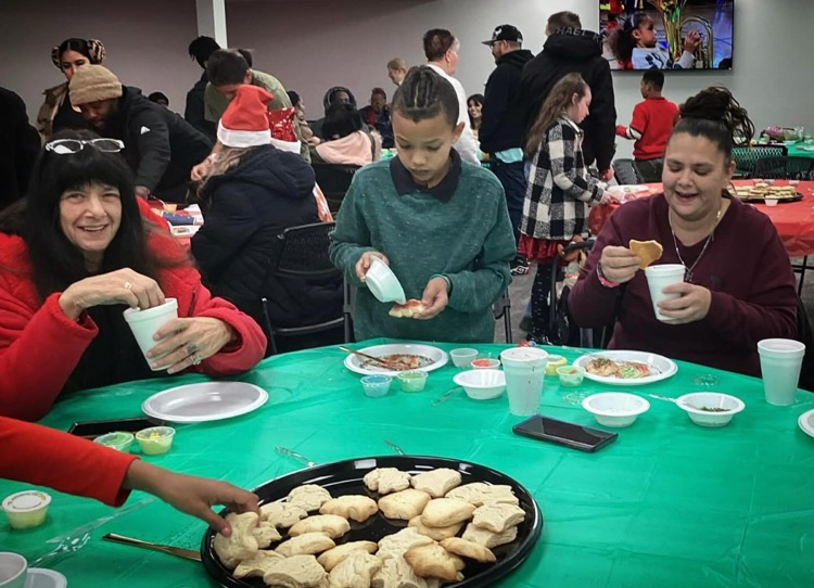 Mickel and his family taking advantage of one of the cookie decorating stations.
