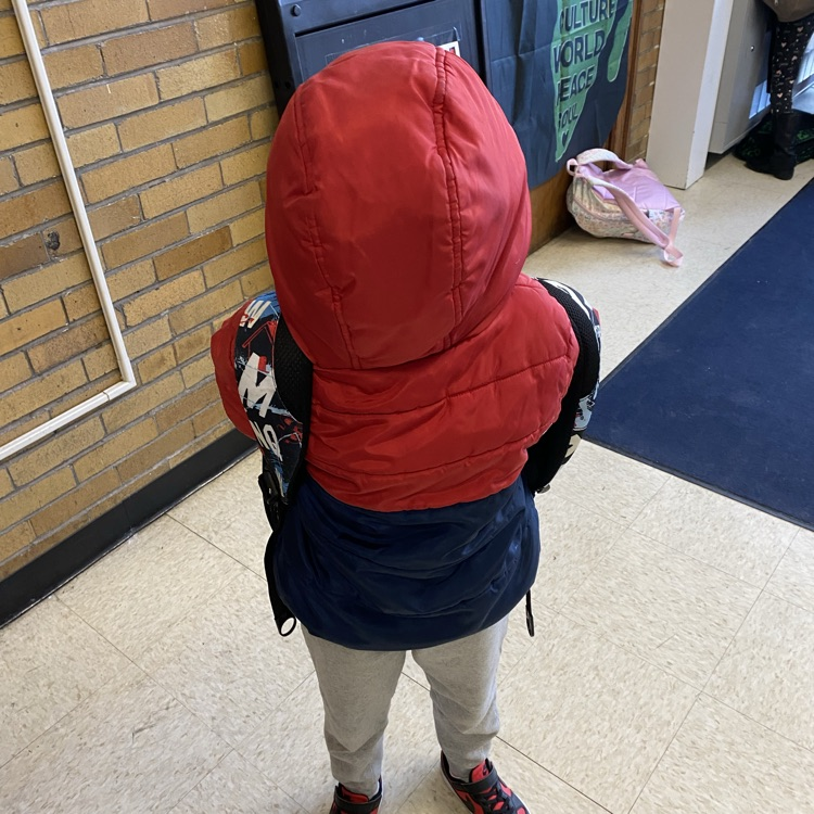 student wearing coat backward