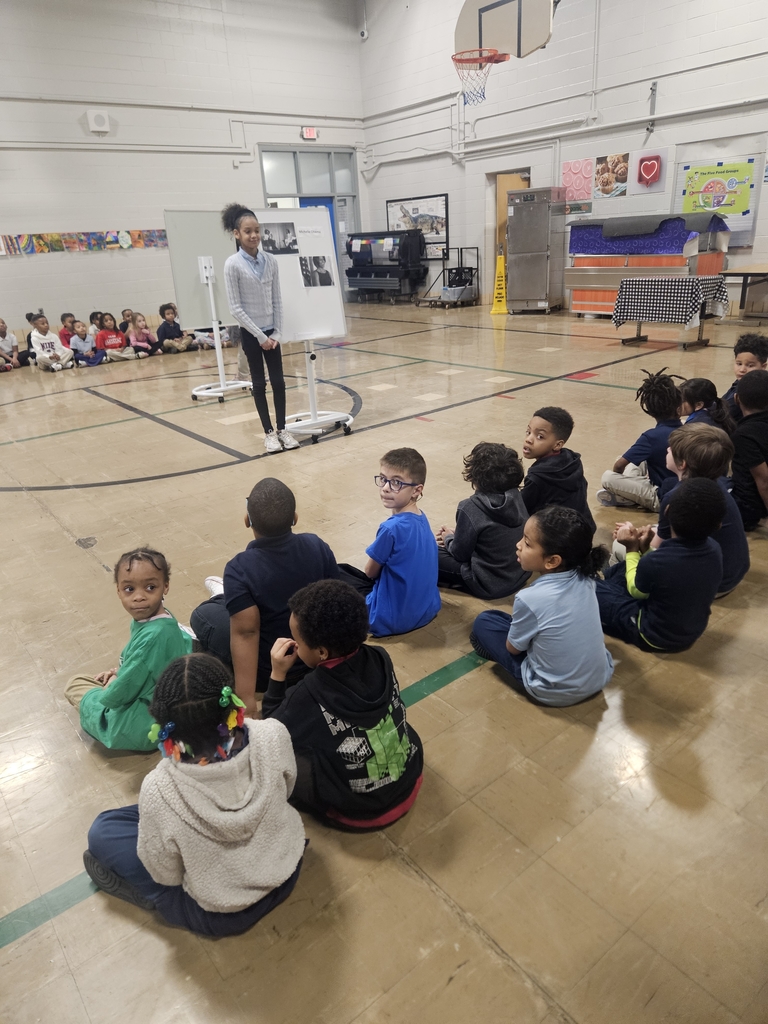 Students learning about Michelle Obama. 