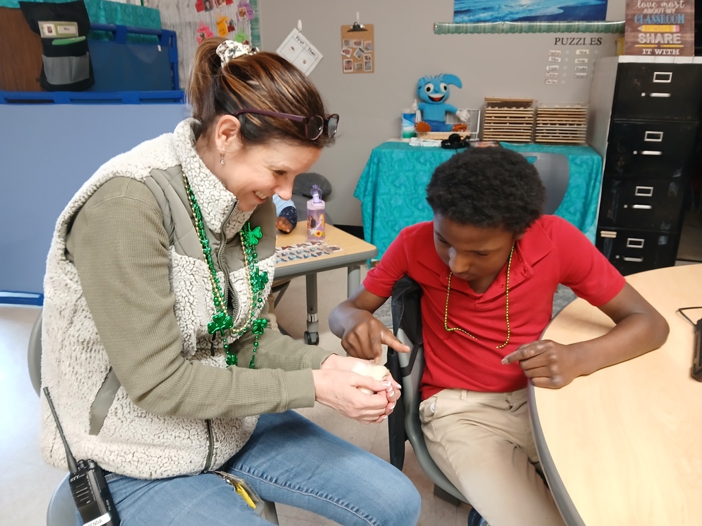 Student and teacher with chick