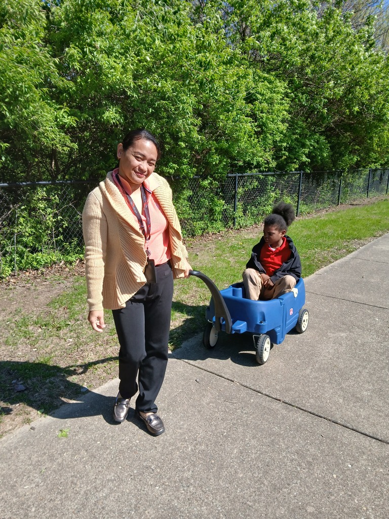 teacher with student in wagon