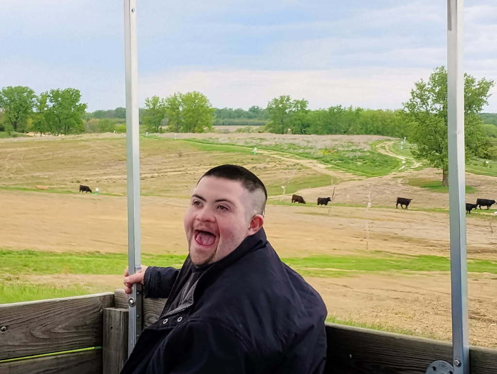 student with cows