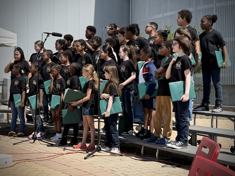 This year we learned the right way to use a choir folder. Look how focused they are! 