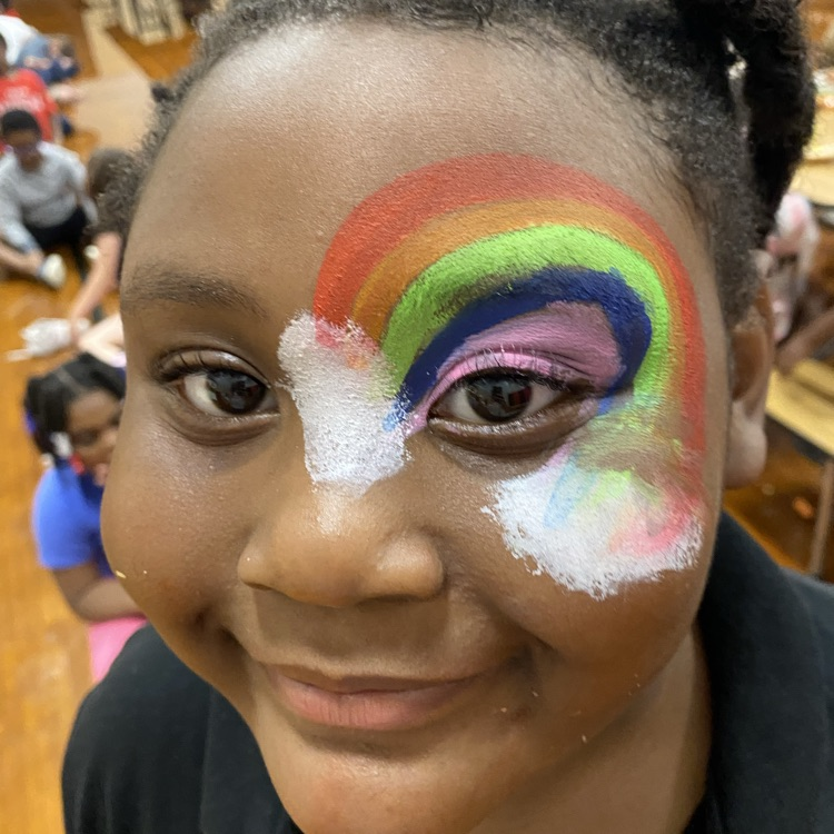 picture of rainbow face paint around left eye
