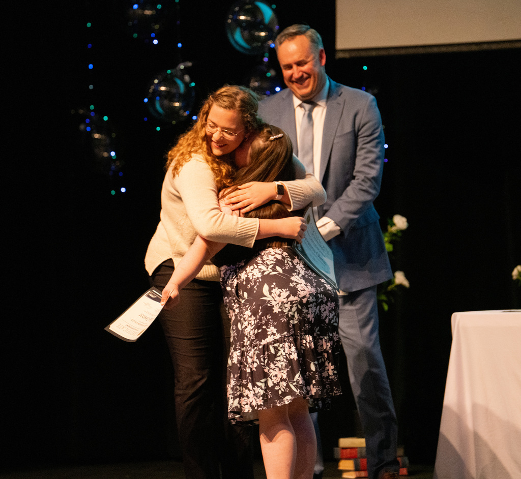 People hugging at the Foundation Scholarship Reception