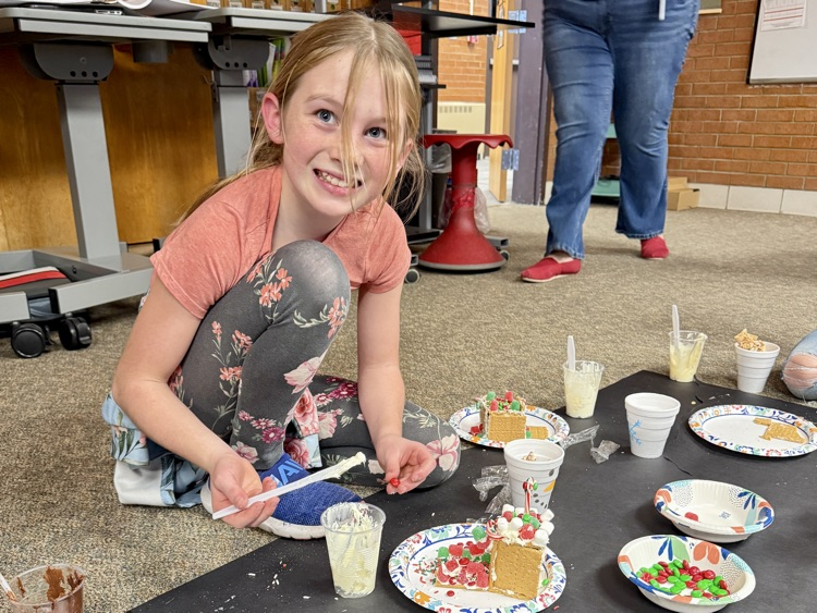 Sixth and First graders partnered with one another to build gingerbread houses. #plainsmenpride