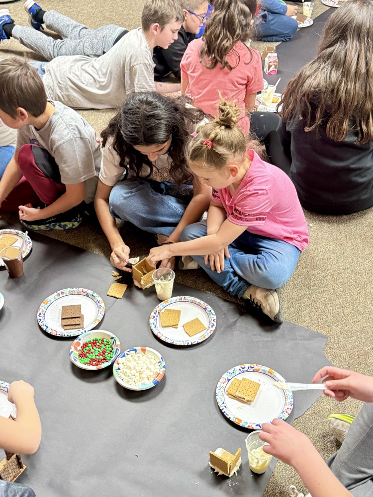 Sixth and First graders partnered with one another to build gingerbread houses. #plainsmenpride