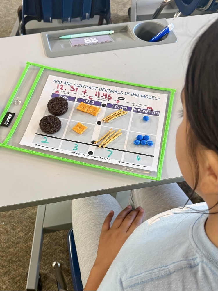 5th graders cooked up some math skills today by using various snacks as manipulatives to model adding decimals. 🥨Ⓜ️🍪