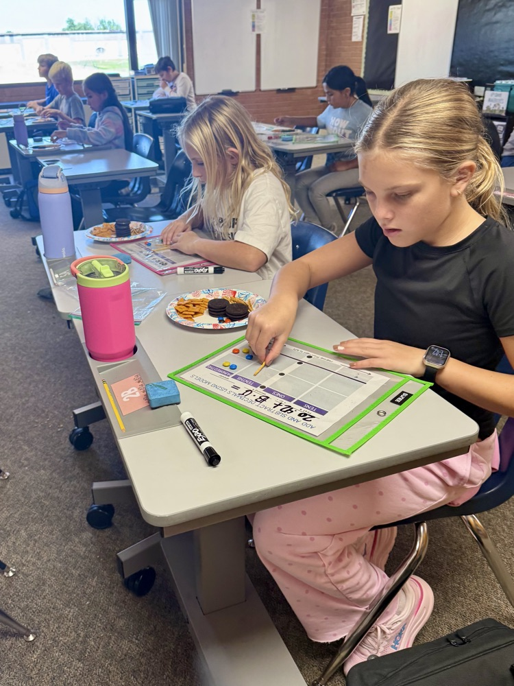 5th graders cooked up some math skills today by using various snacks as manipulatives to model adding decimals. 🥨Ⓜ️🍪