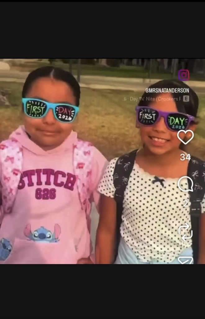 Two girls wearing "first day of school" sunglasses