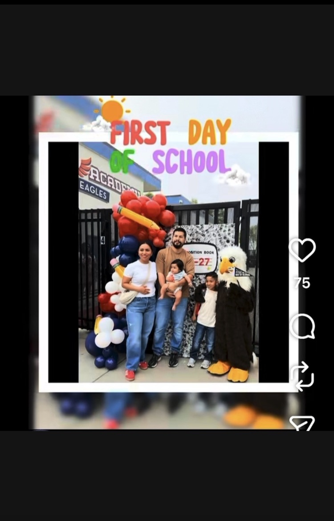 Families posing for photo with school mascot