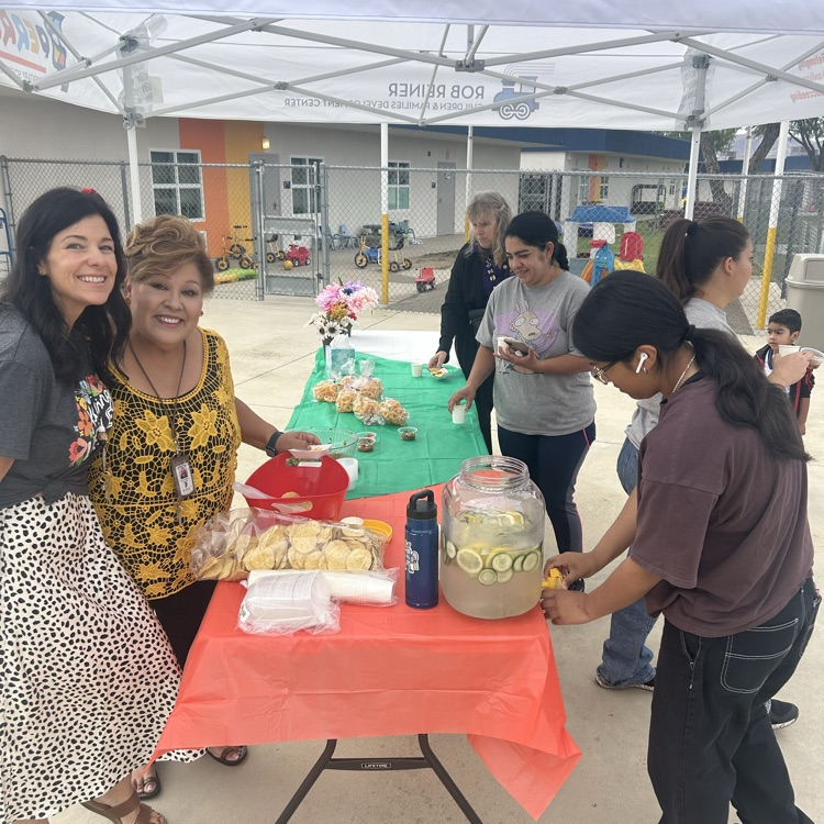 Parents and staff enjoying Happy Harvest festivities